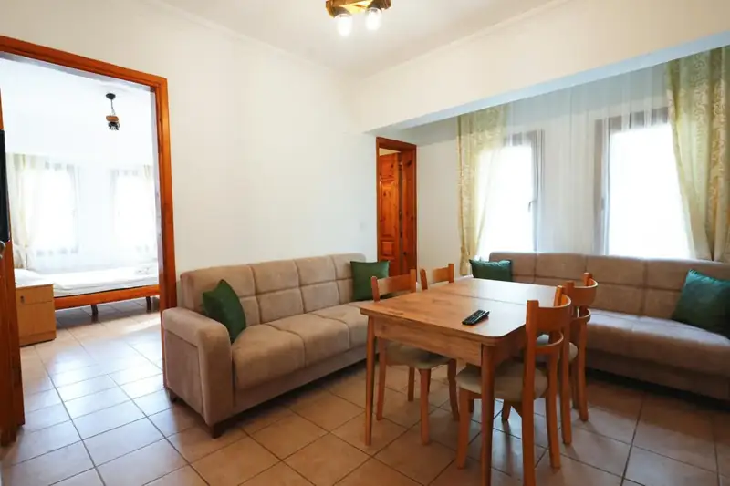 The living area with the bedroom beyond